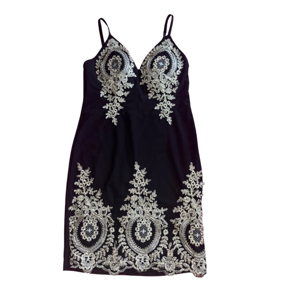 Embroidered bodycon black dress with gold detail.